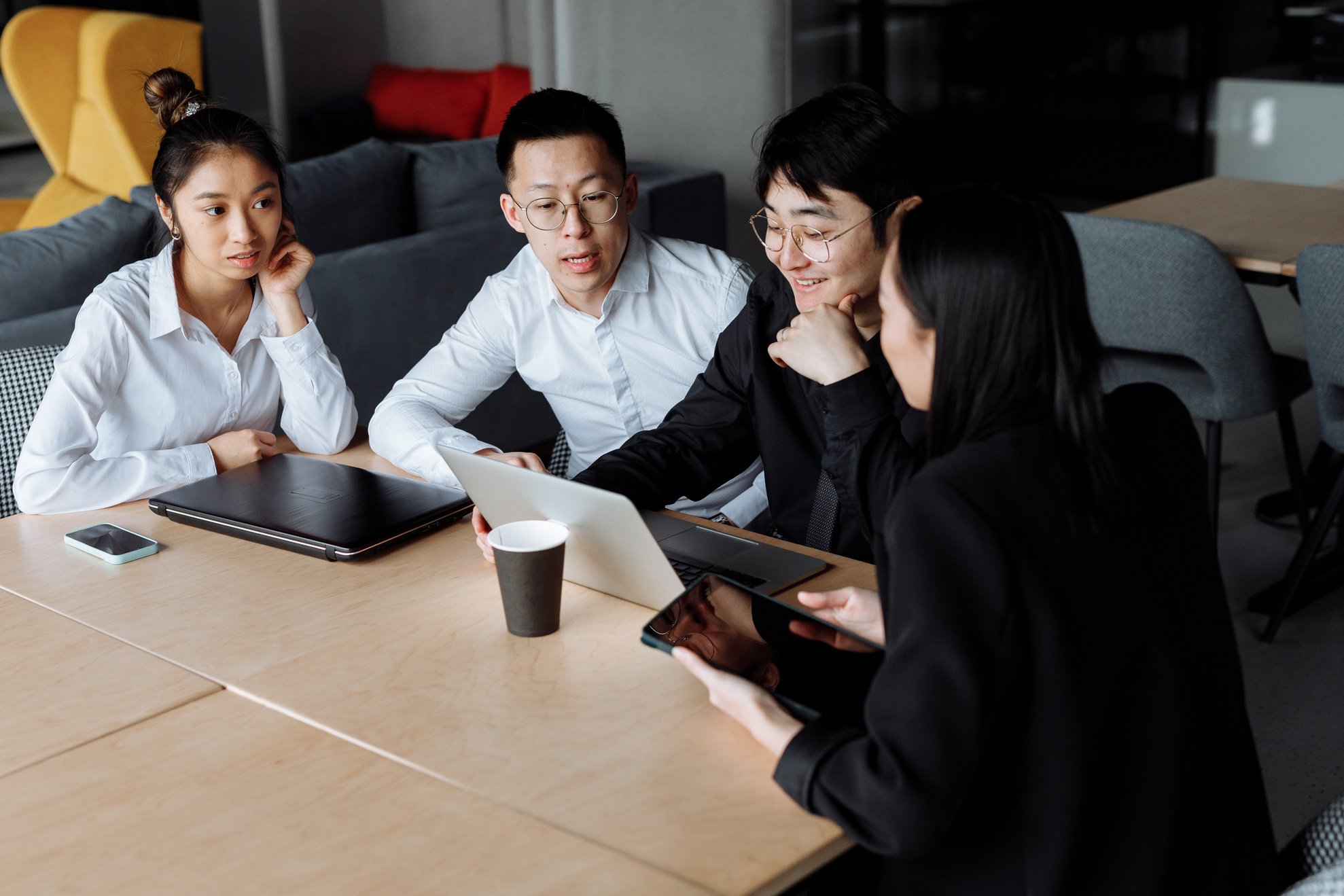 A Group of People Having a Meeting in the Office